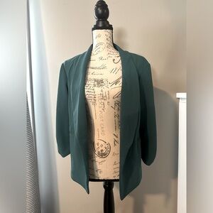 Maurice’s teal blazer